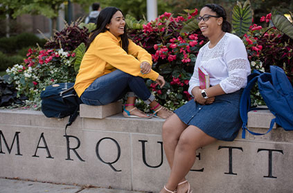 Photo of two students on campus. Link to Gifts of Cash, Checks, and Credit Cards