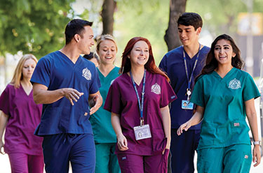 Group of nursing students walking together. Links to Jeff Carpenter, Dent ’86 story