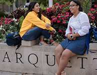 Photo of two students on campus. Link to Gifts of Cash, Checks, and Credit Cards